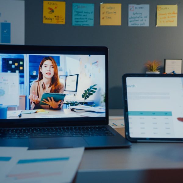 young-asia-financial-student-ladies-watching-lesson-online-studying-with-laptop-tablet-living-room-from-home-night (1)